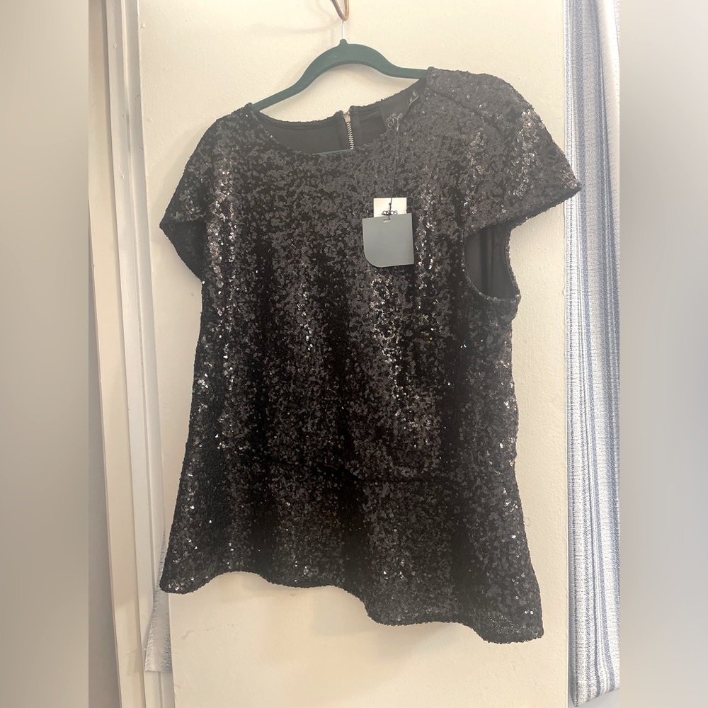 Black sequins peplum top size 20. New w/tags. Smoke and pet free home.